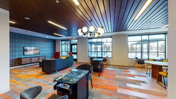 A room with a blue wall and a wooden ceiling at The Bessemer at Seward Commons Apartments, MN, 55404