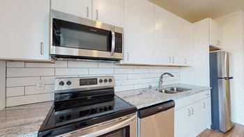 Fully Equipped Kitchen at The Bessemer at Seward Commons Apartments, Minneapolis