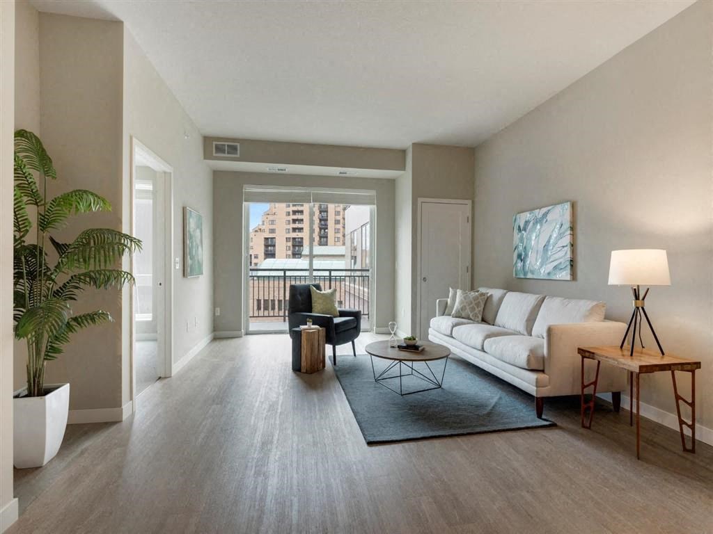 Brown sofa with grey chair at The M on Hennepin, Minnesota