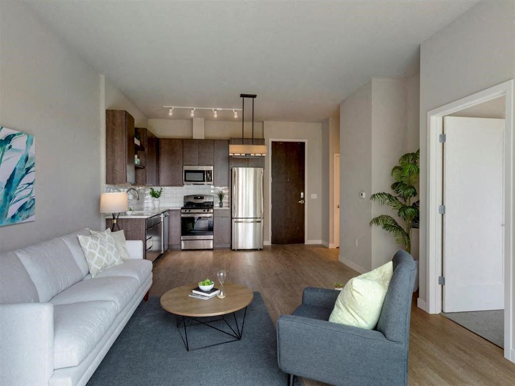 white sofa and grey chair in living area at The M on Hennepin, Minneapolis, MN