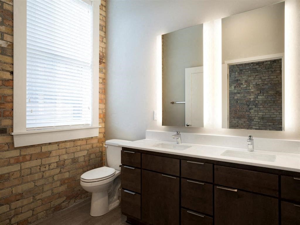 Bathroom with large mirror and storage at The M on Hennepin, Minnesota, 55414