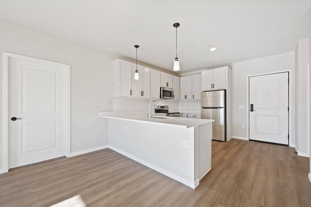 Living room along with kitchen at Lochner Apartments, Minnesota