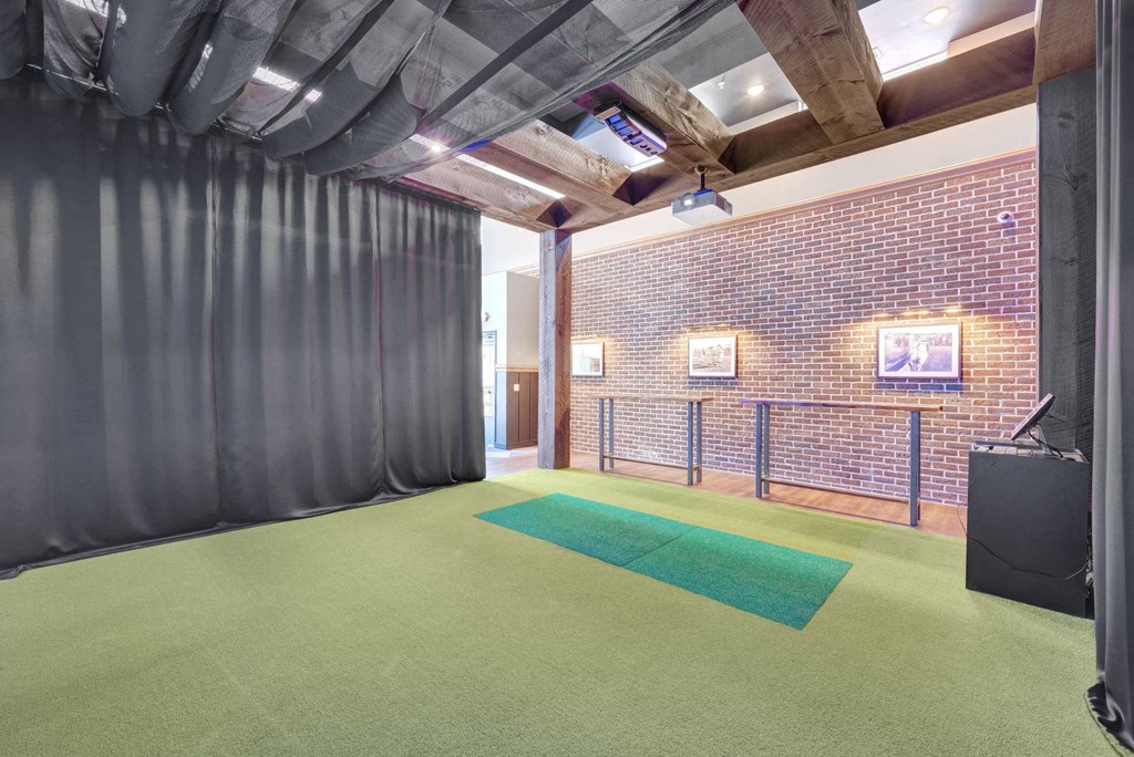 Room with black curtains, computer and a projector at Lochner Apartments, White Bear Lake, 55110