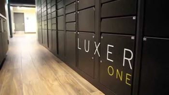 A hallway with the words "LUXER ONE" written on the wall.