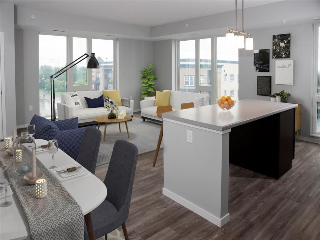 A modern kitchen with a dining table and chairs.