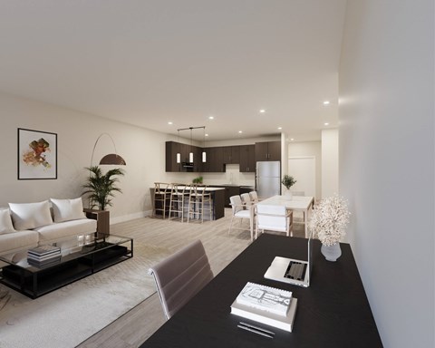 A modern living room with a black coffee table and white furniture.