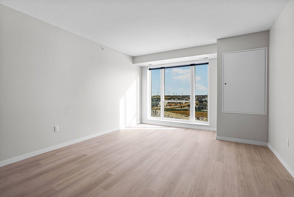 A room with a sliding glass door leading to a balcony.at Croft at Rosecott, Rosemount 