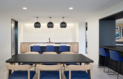 Dining Area with a Large Table at Peregrine Apartments, Minneapolis