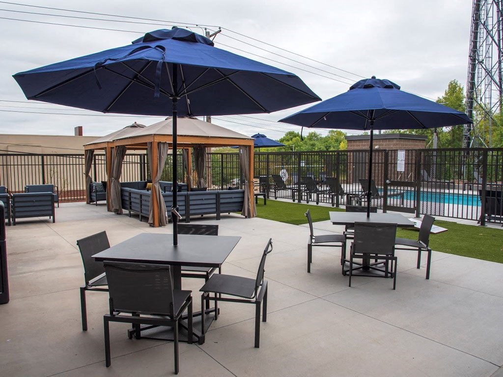 UPII outdoor patio with seating, firepit and cabanas at Urban Park I and II Apartments, St Louis Park, Minnesota
