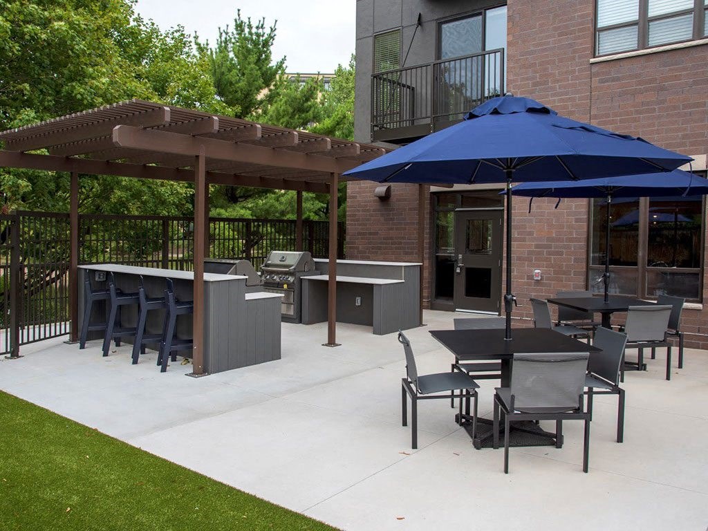 UPII outdoor patio with grilling stations and seating at Urban Park I and II Apartments, Minnesota, 55426
