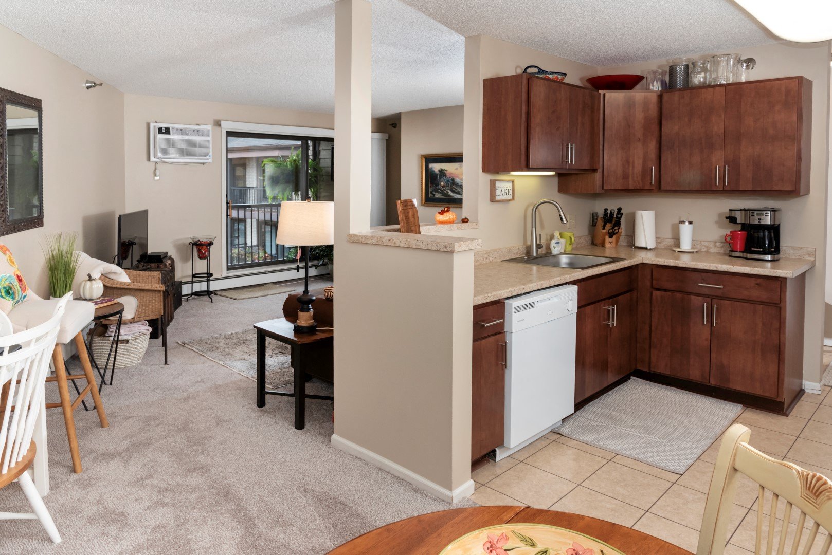 a view of a kitchen and living room with a dining room table
