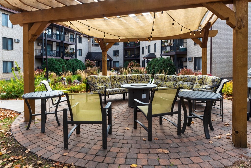 outdoor seating with fire pit in courtyard of riverview highlands apartments