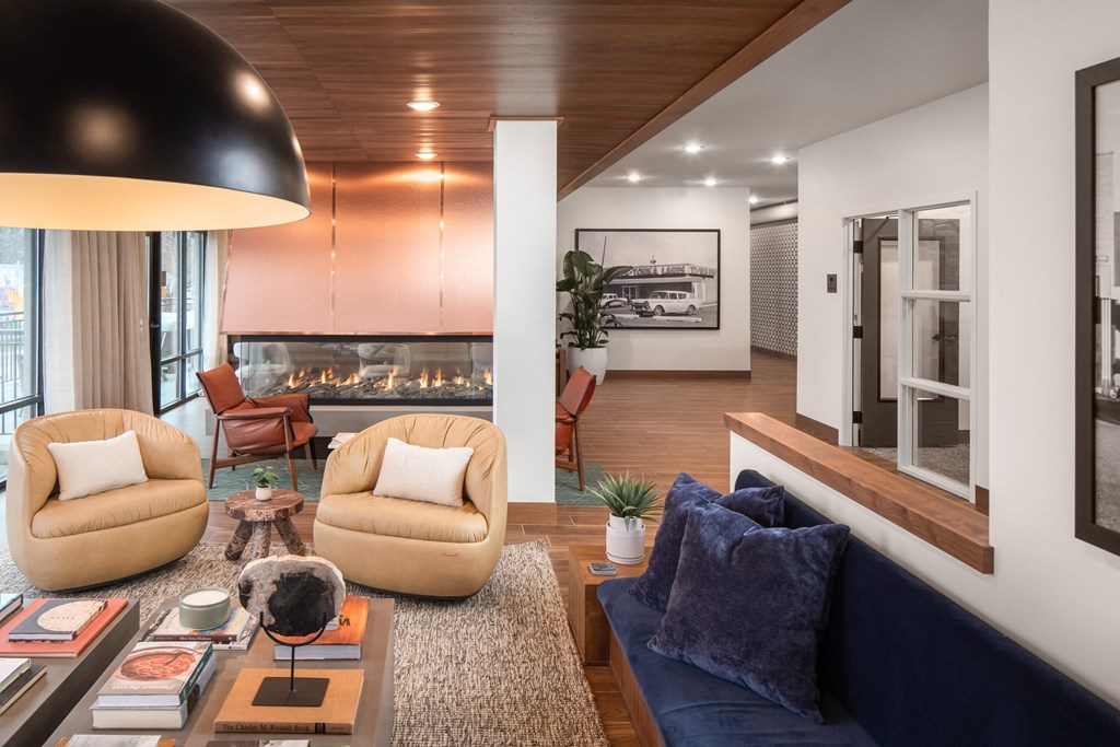 a living room filled with furniture and a fire place
