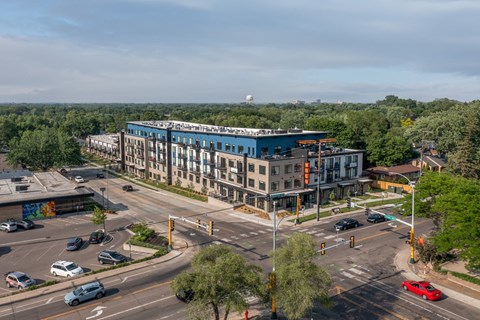 an aerial view of a large building with a blue roof