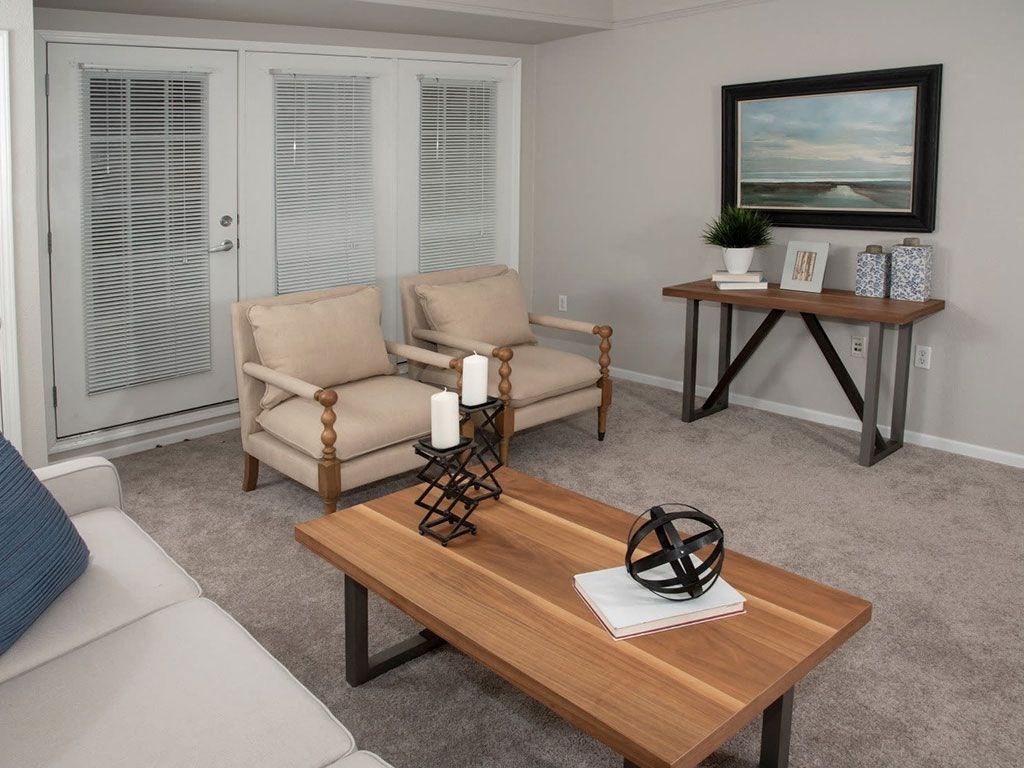 Living room with patio or balcony