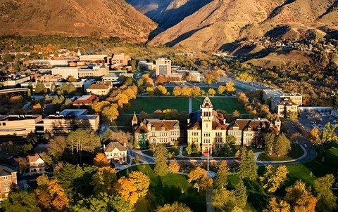 an aerial view of the campus with mountains in the