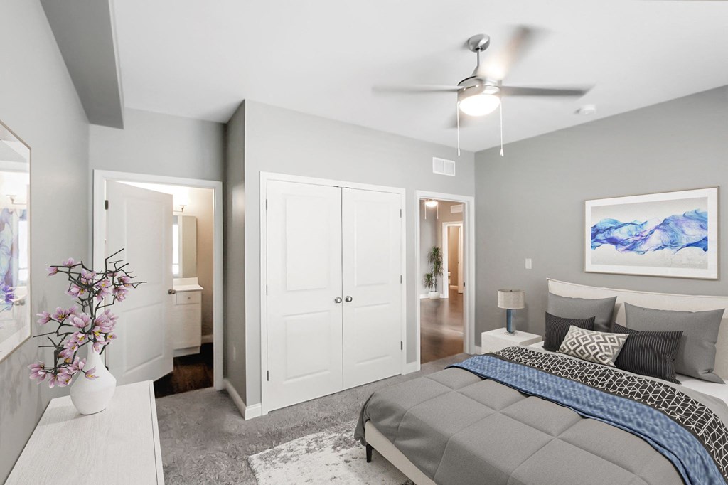 a bedroom with a bed and a closet