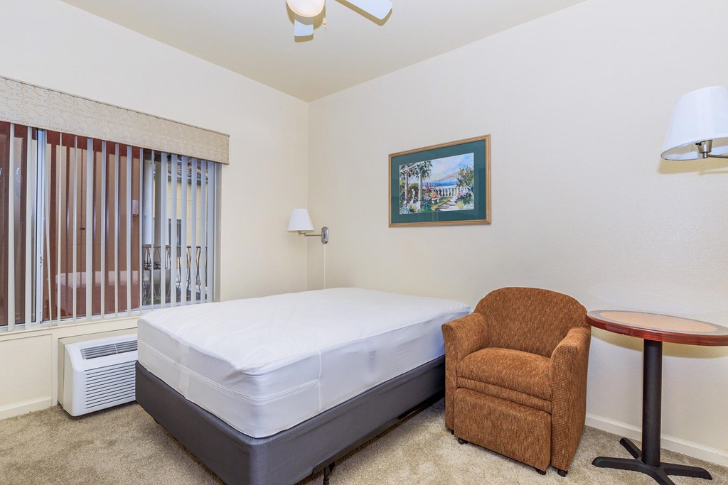 A Bedroom With a Painting On The Wall at Atrium Garden Apartment Homes, LLC, San Jose