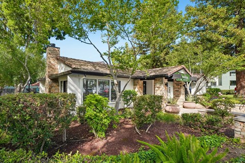 A house with a garden in front of it.