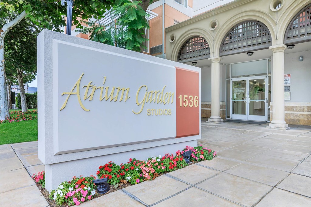 A White Sign With Gold Lettering at Atrium Garden Apartment Homes, LLC, San Jose, 95112