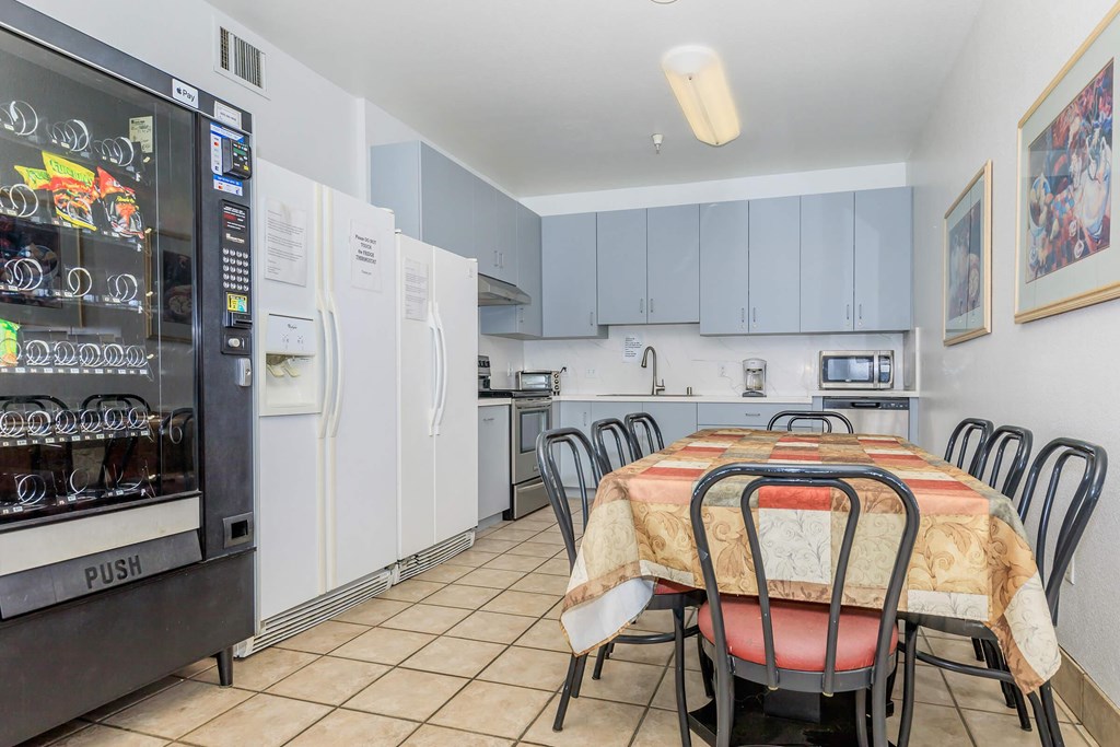 A Kitchen With a Table And Chairs at Atrium Garden Apartment Homes, LLC, San Jose