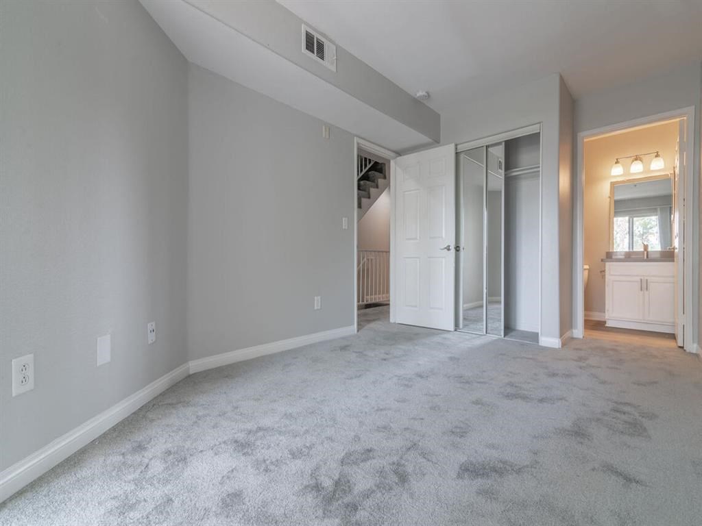 a room with a carpet with different colored lights on it at Warner Center Townhomes, Canoga Park
