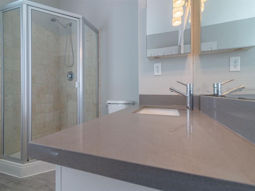 a bathroom with a sink and a shower at Warner Center Townhomes, Canoga Park California