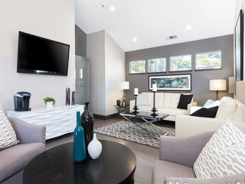 a living room with couches a table and a television at Skyline Heights Apartments, Daly City, CA, 94015