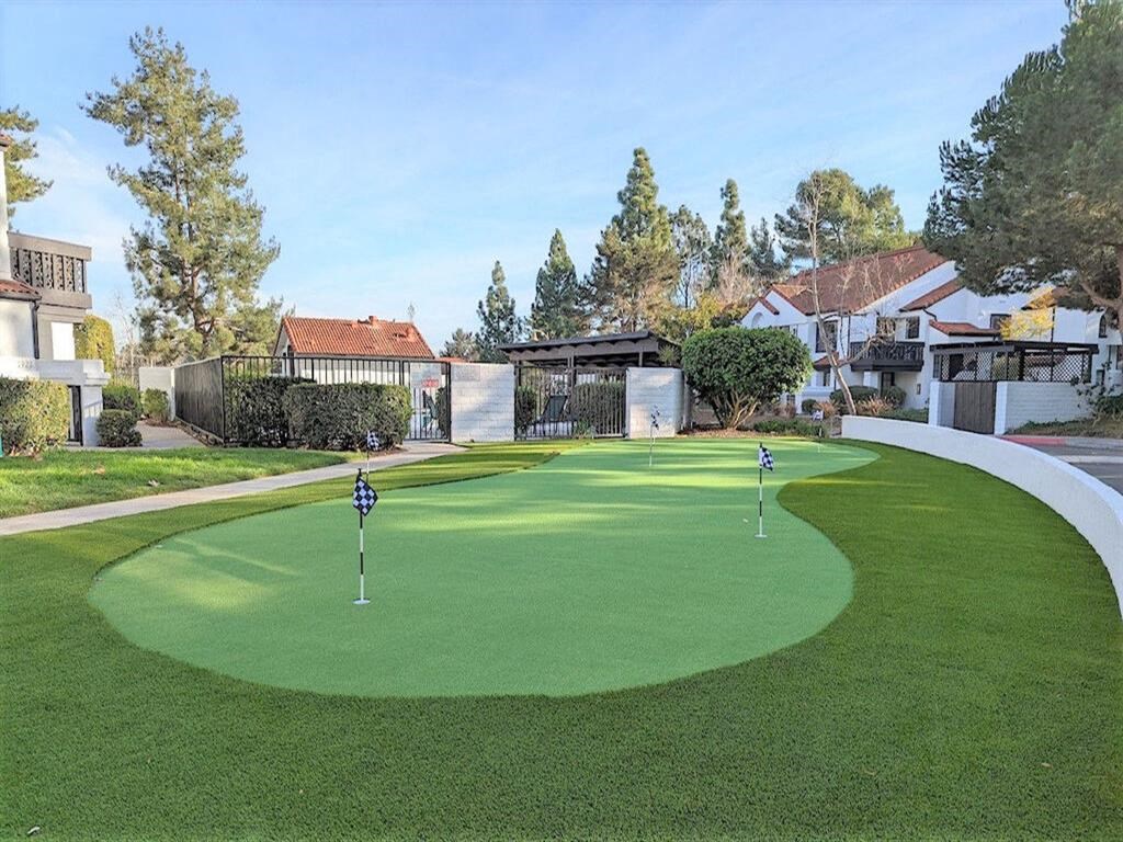a putting green with houses in the background  at The Resort at Encinitas Luxury Apartment Homes, Encinitas, CA