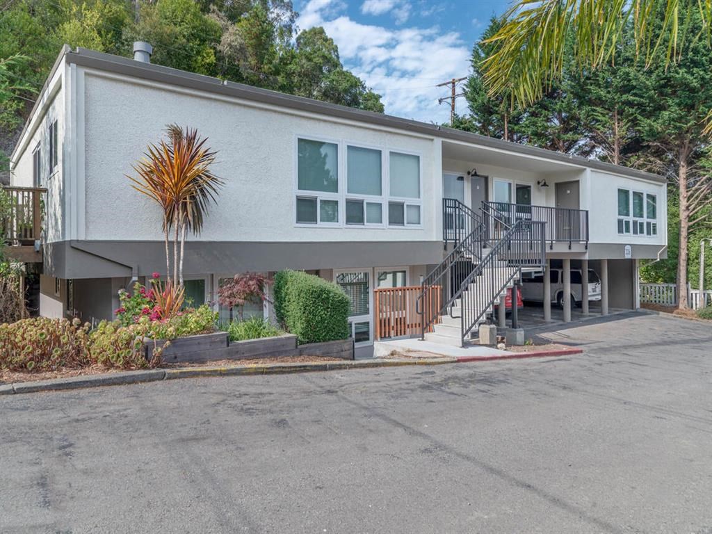 the front of a house with stairs and a driveway at Trailhead Apartments at Tam Junction, California