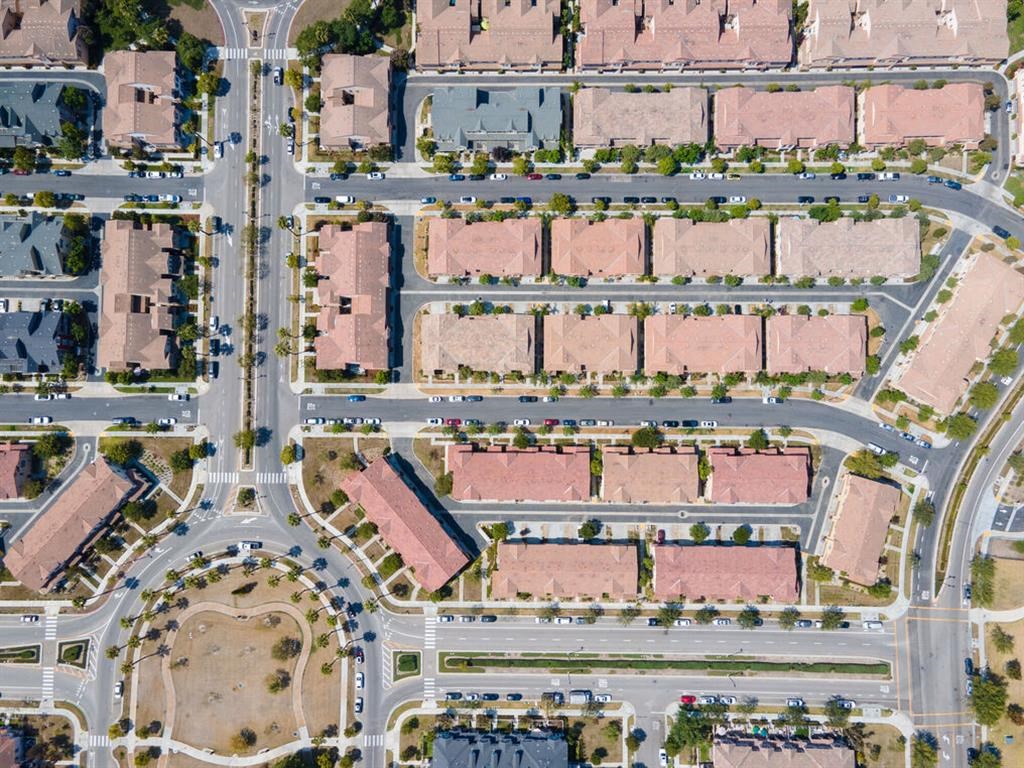 a birdseye view of a street intersection with cars and houses at The Vines at Riverpark, LLC, Oxnard