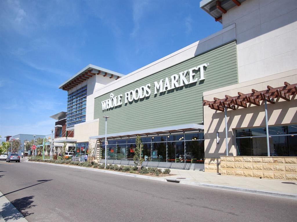 a store front of a market with a street in front of it at The Vines at Riverpark, LLC, Oxnard, CA 93036
