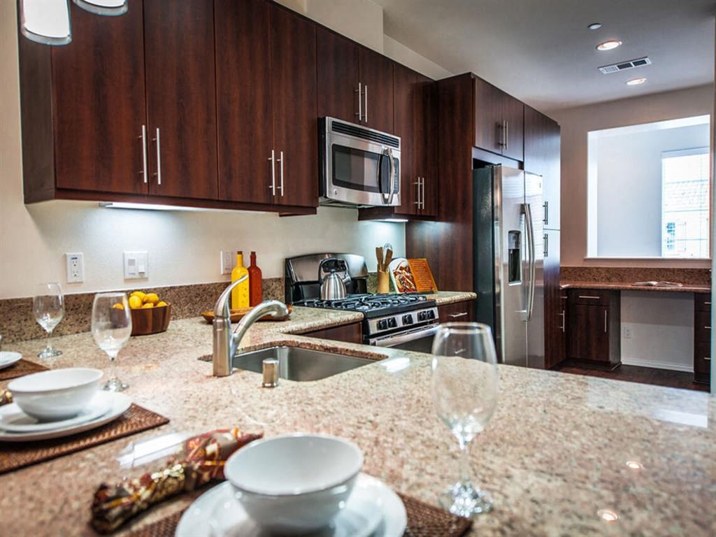a kitchen with a sink and a counter top at The Vines at Riverpark, LLC, California, 93036