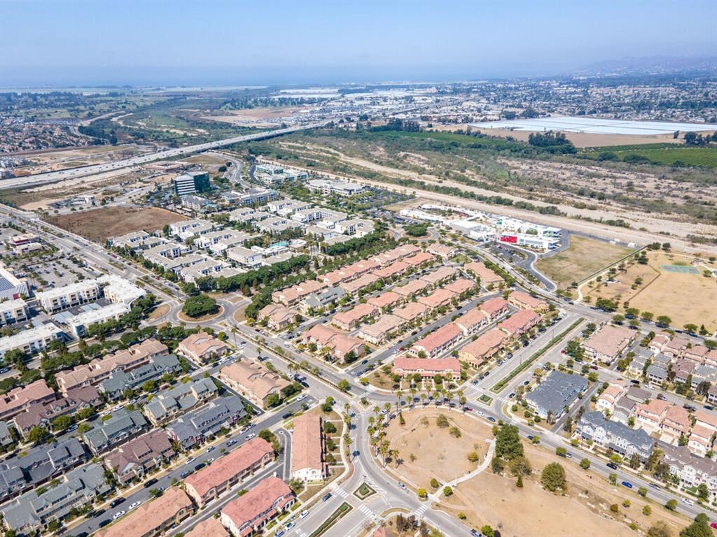 an aerial view of an urban area with buildings and roads at The Vines at Riverpark, LLC, Oxnard, CA