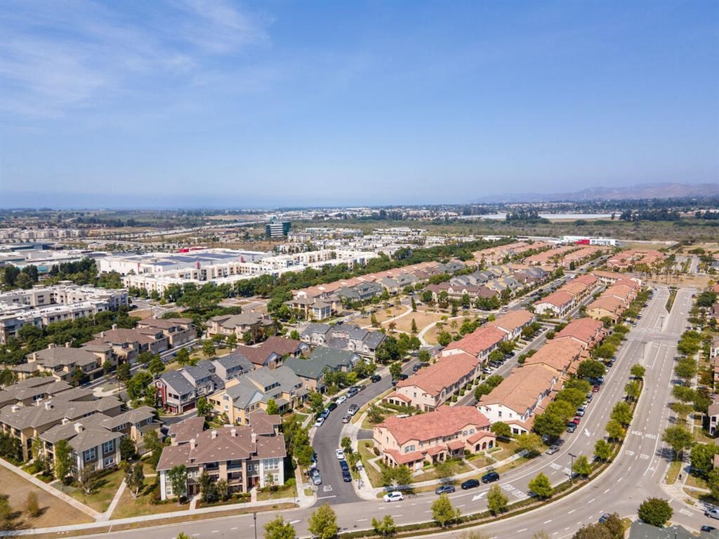 an aerial view of a suburb of a city with cars on the street at The Vines at Riverpark, LLC, California, 93036