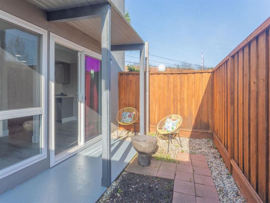 a rendering of a porch with chairs and a table  at The Preston at Hillsdale, California