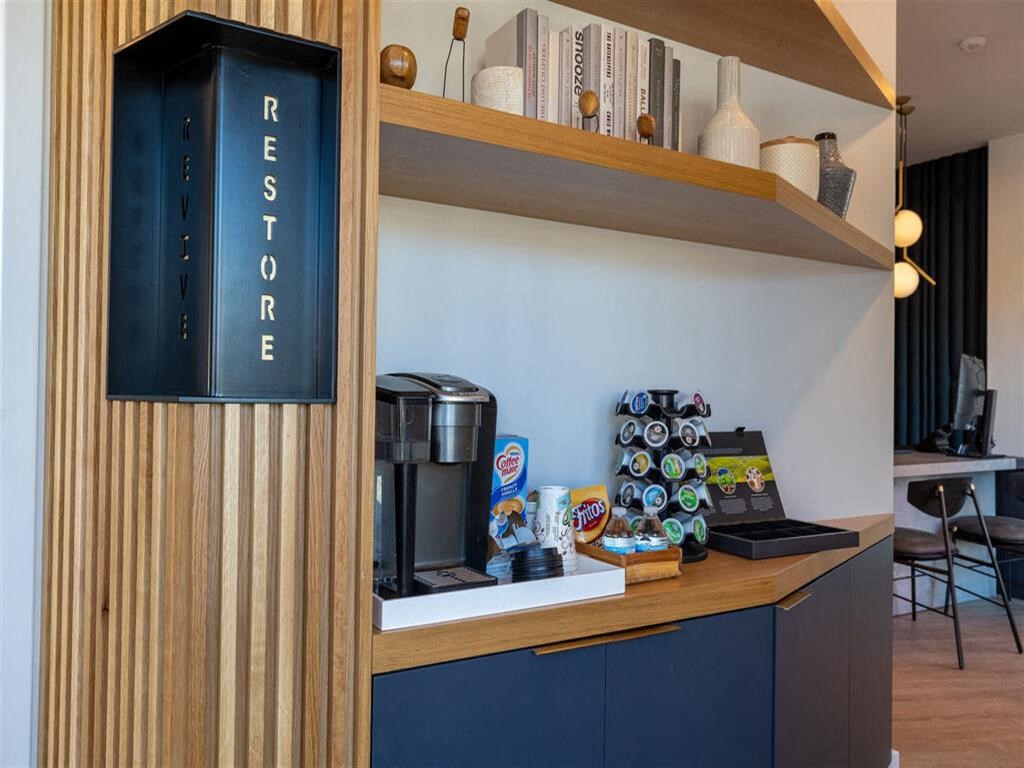 a coffee maker on a counter in a hotel room  at The Preston at Hillsdale, San Mateo, California