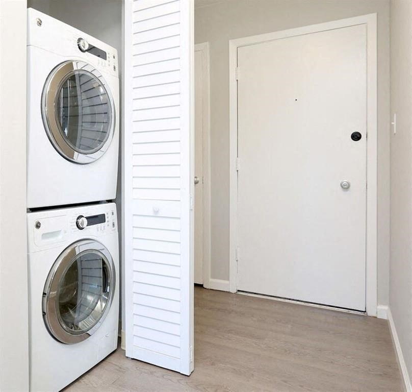 a washer and dryer in a room next to a closet at The Pier at Sausalito, Sausalito