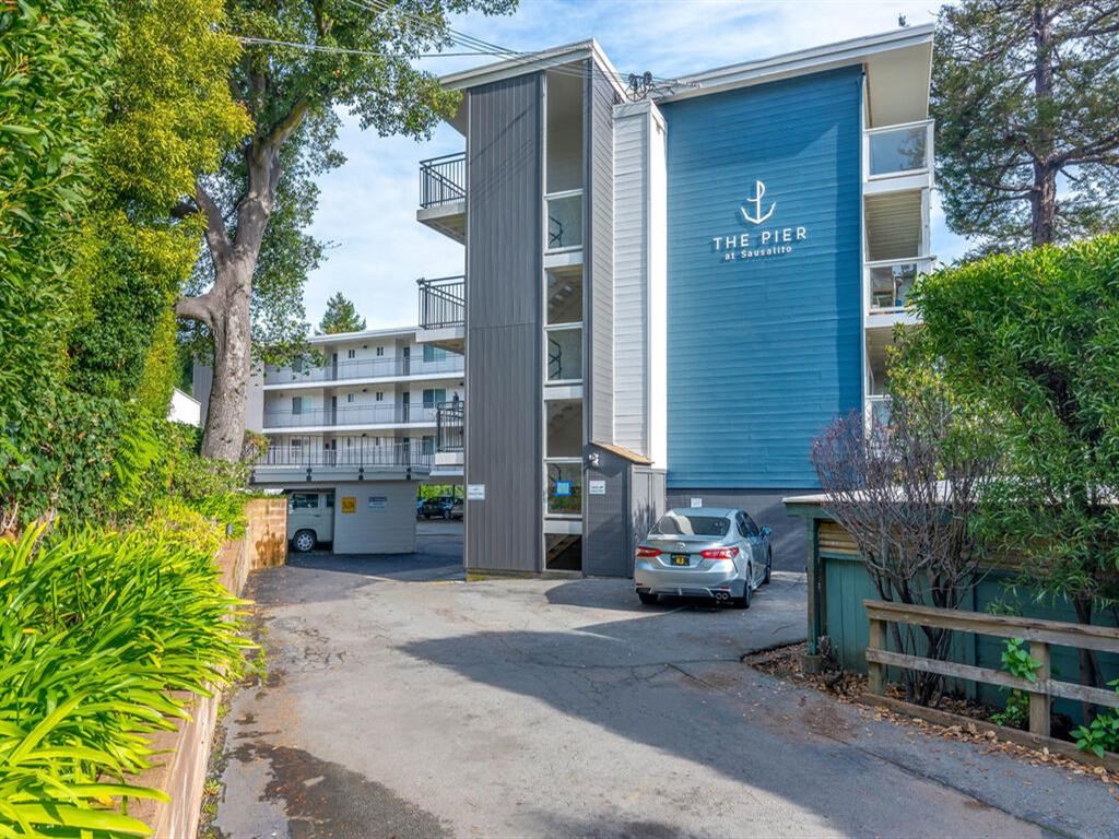 a car is parked in front of a large building at The Pier at Sausalito, Sausalito, CA 94965