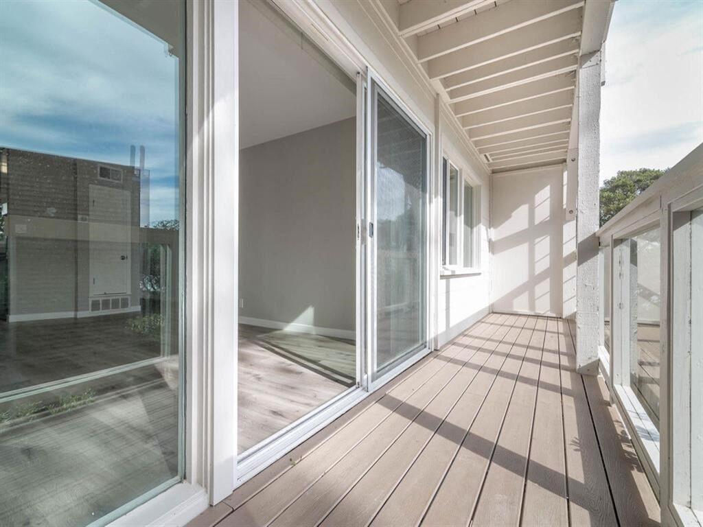 a view of the balcony of a home with large glass doors at The Pier at Sausalito, Sausalito, CA 94965