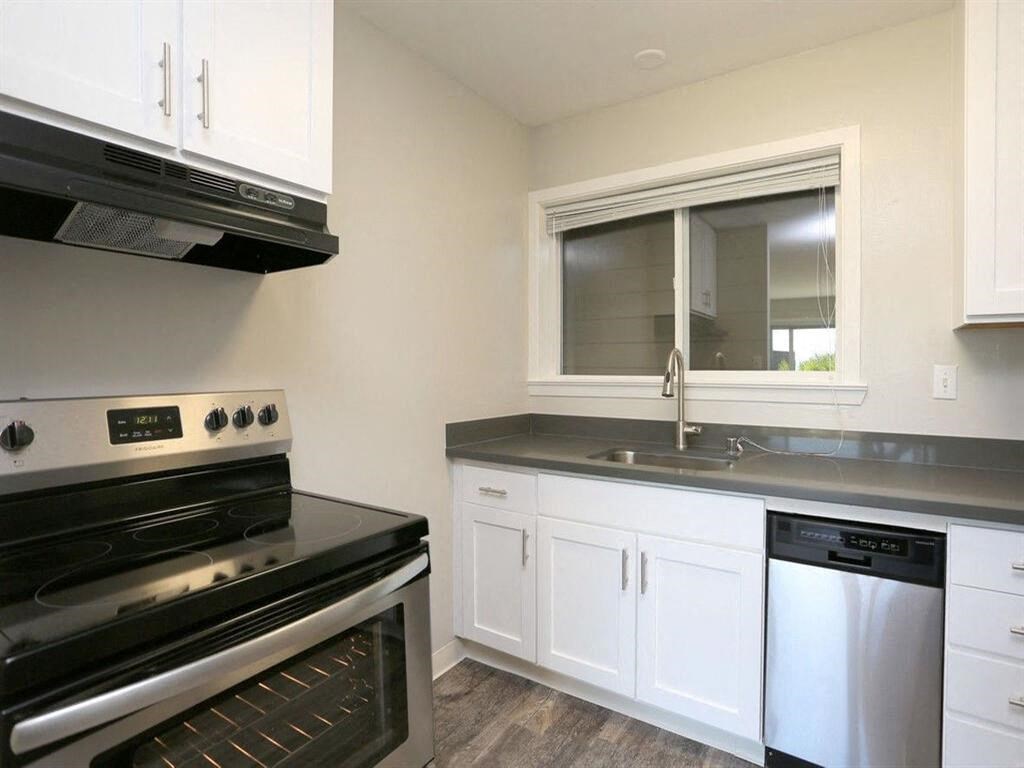 a kitchen with a stove and a sink and a window at The Pier at Sausalito, Sausalito