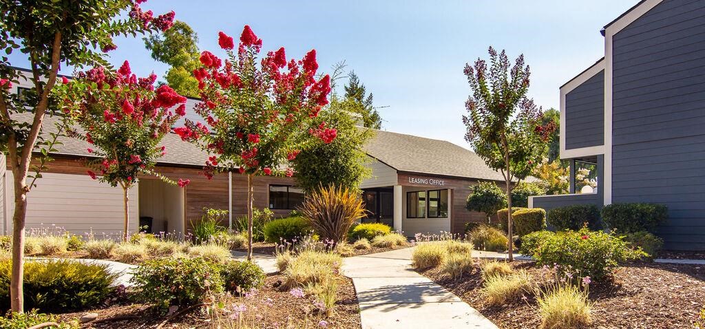 a house with a sidewalk and trees in front of it at Parc Medallion LLC, Union City