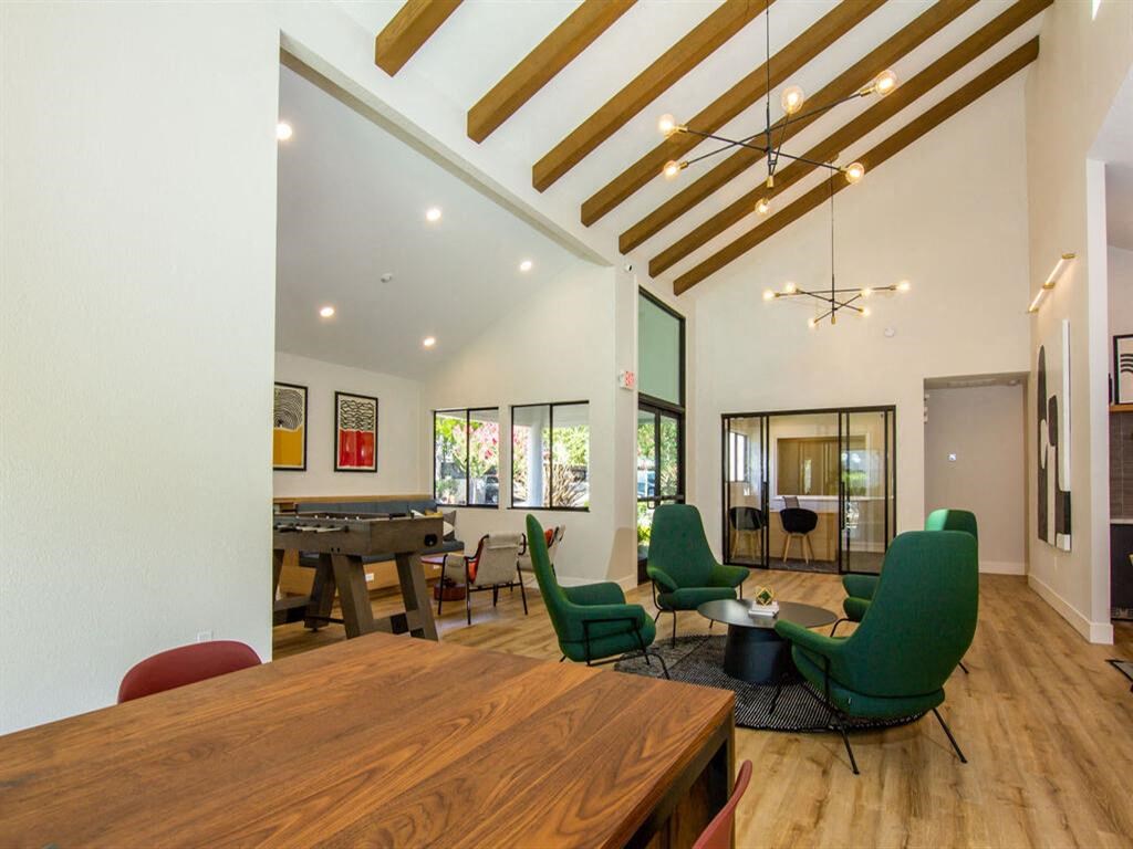 a game room with a table and chairs and a pool table at Parc Medallion LLC, Union City, CA 94587