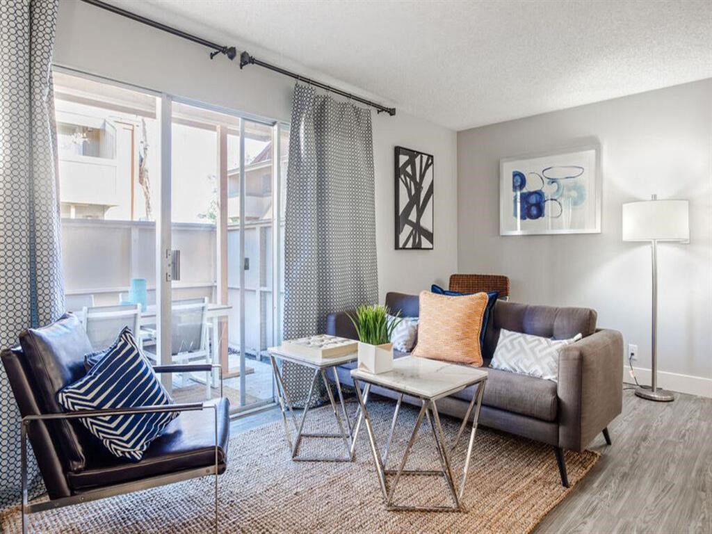 a living room with a couch and a table at Parc Medallion LLC, Union City California