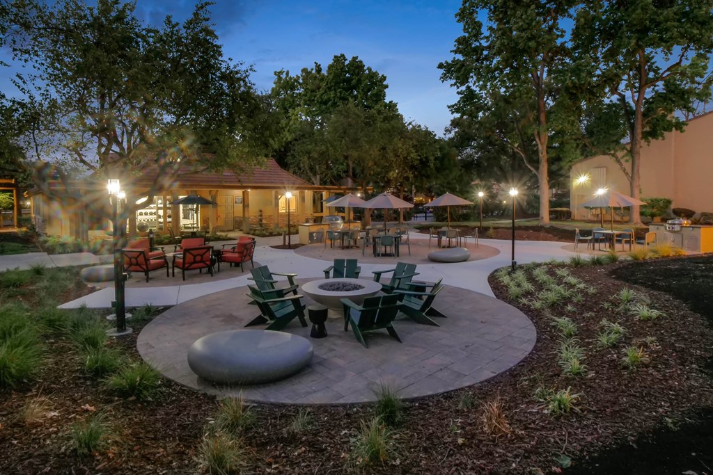 a patio with tables and chairs at Summerwood Apartments, Santa Clara, CA 95050
