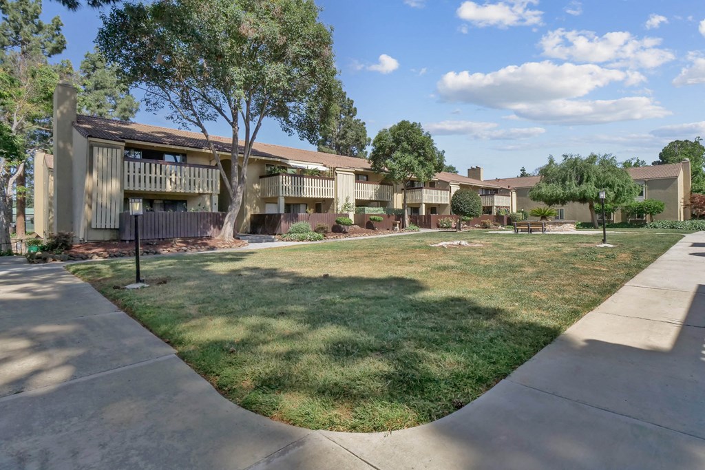 a reflection of a house in a glass window at Summerwood Apartments, Santa Clara, California