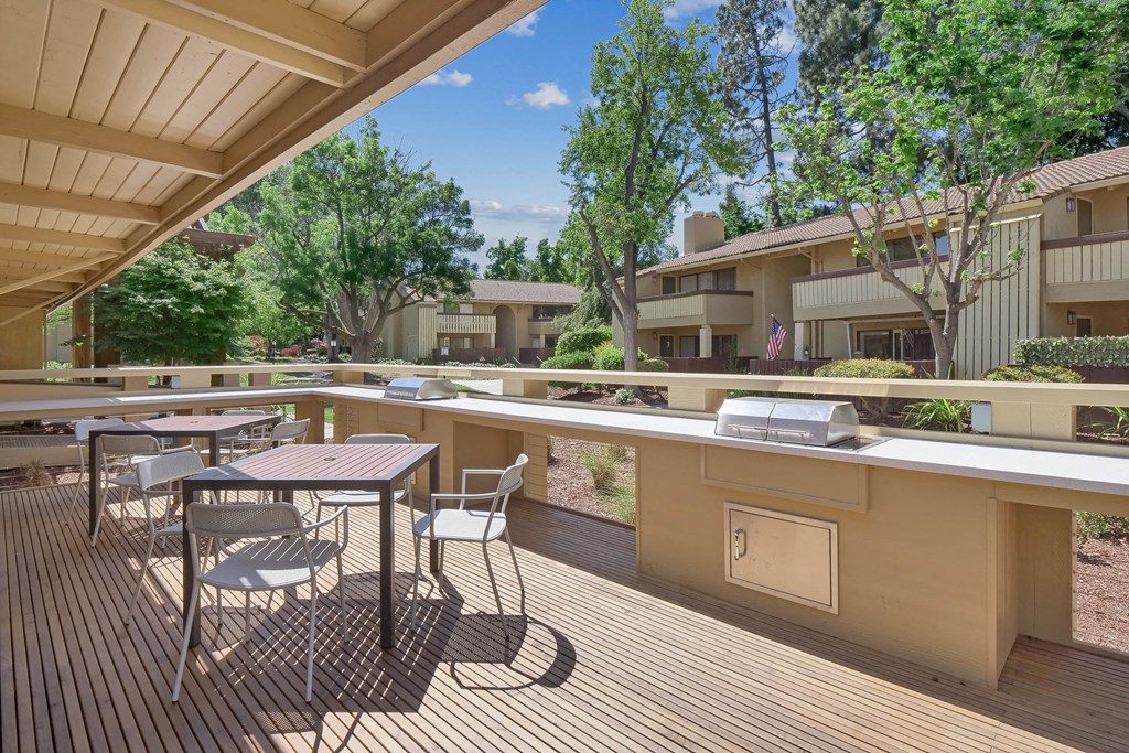 a rendering of a balcony with trees and benches at Summerwood Apartments, Santa Clara, CA 95050