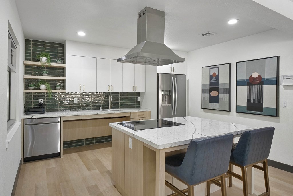 a kitchen with a large island and three chairs at Summerwood Apartments, Santa Clara, 95050