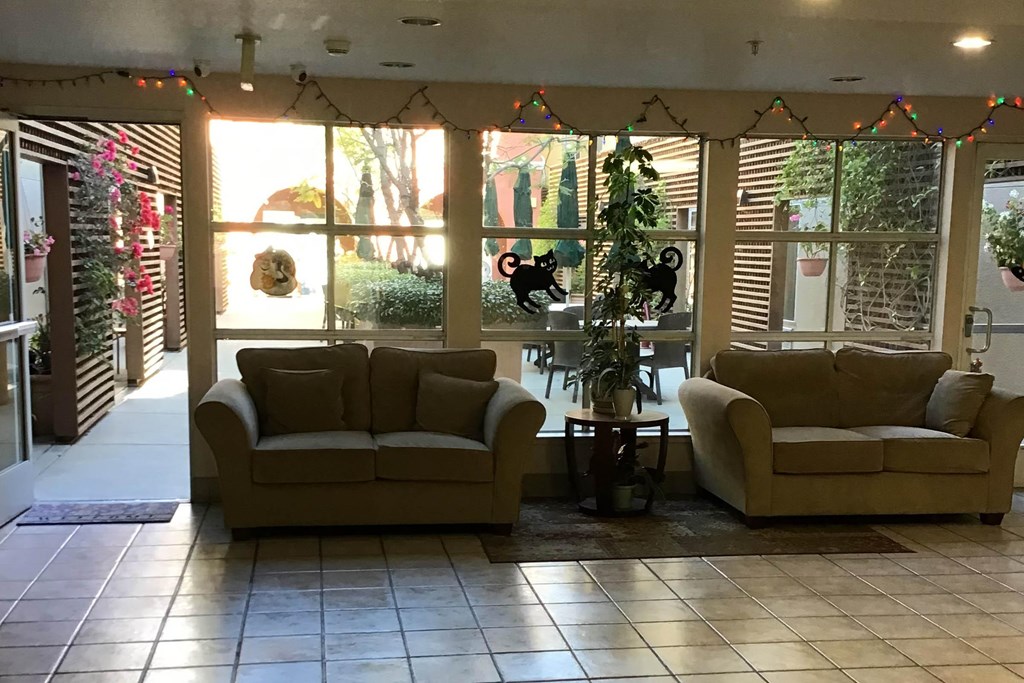 Two Couches Are Placed In a Room at Atrium Garden Apartment Homes, LLC, San Jose, California
