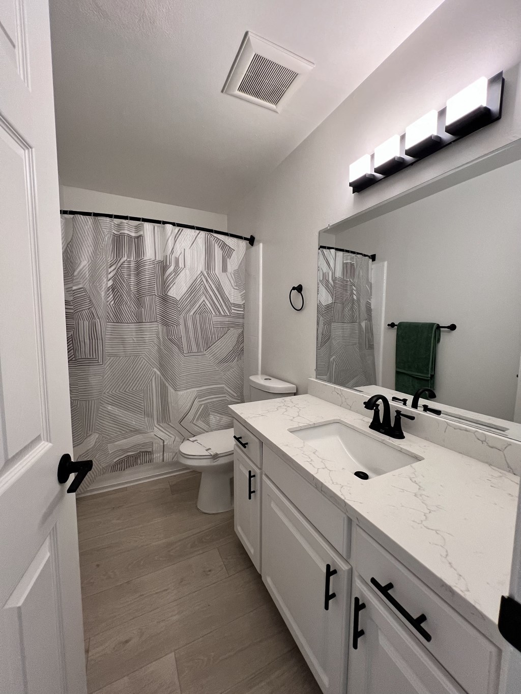 a bathroom with a sink and a shower and a toilet at Campbell West Apartments, Campbell